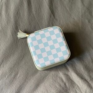 Travel jewelry case checkered white blue with tassel